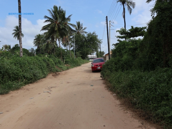 Minor access road to 40 by 80 plots with a perimeter wall| Benford Homes