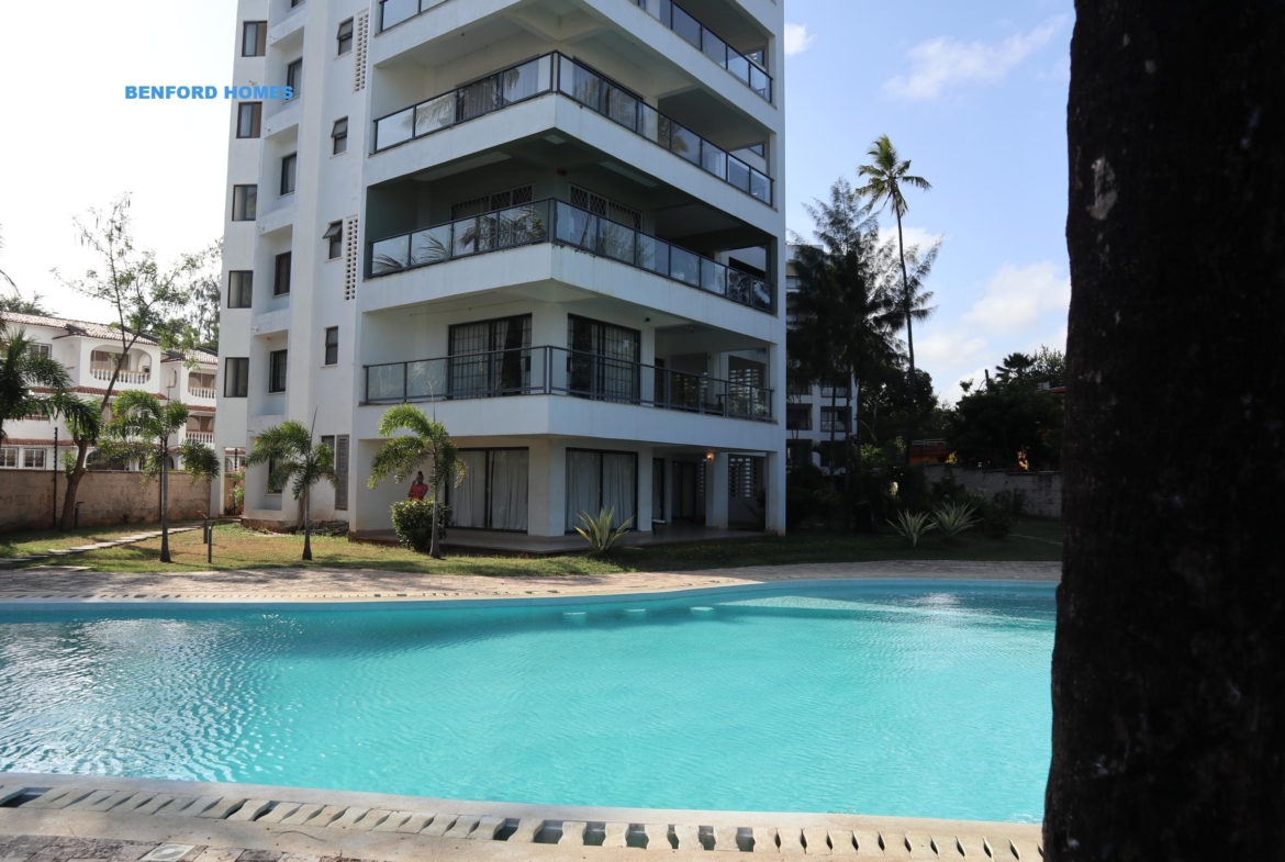 Sky blue swimming pool edging with an imposing 3 bedroom modern apartment| Benford Homes