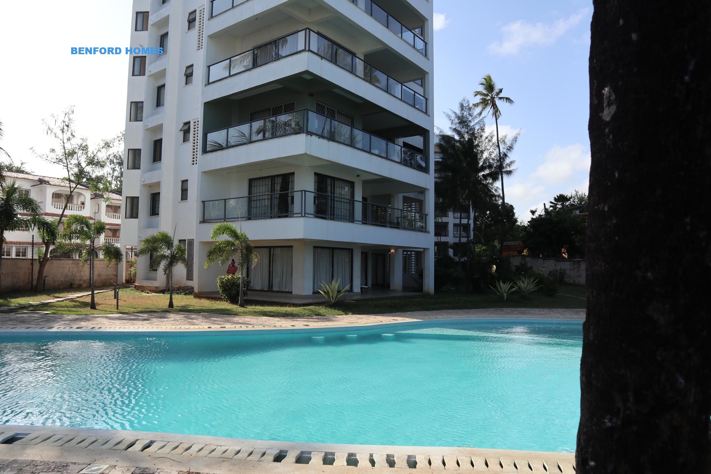 Sky blue swimming pool edging with an imposing 3 bedroom modern apartment| Benford Homes