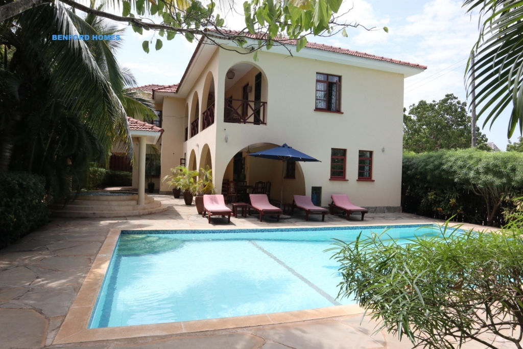 One storey lavish apartment with a swimming pool and lined with a hedge fence| Benford Homes
