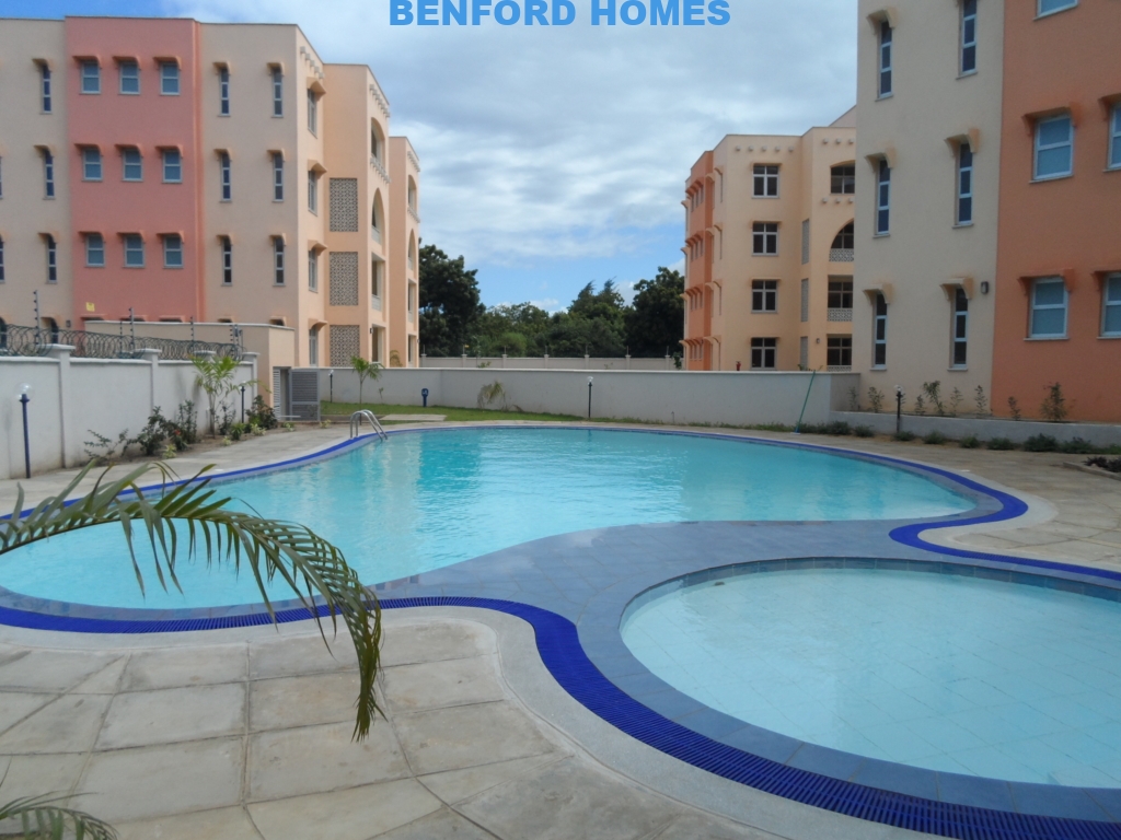 Marseille shaped pool with 2 bedroom apartments standing near the pool | Benford Apartments for Rent in Mtwapa