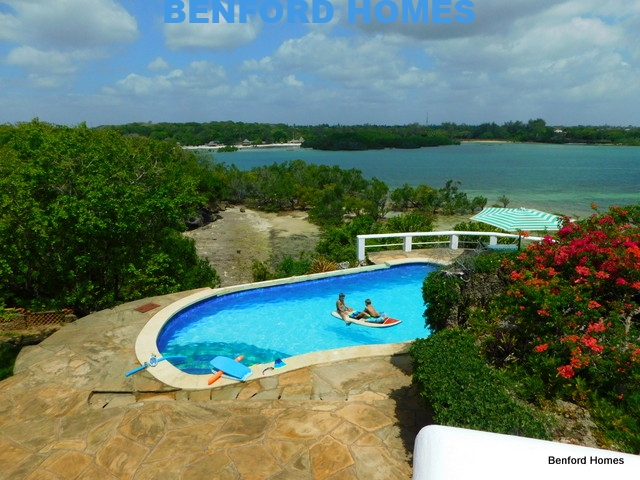 Kids swimming at the pool in the 4 bedroom villa on sale in Shanzu | Benford Homes